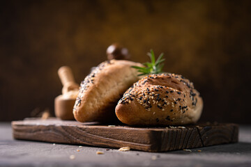 Fresh homemade bread whole wheat baguette on napkin and abstract table. Sourdough bread
