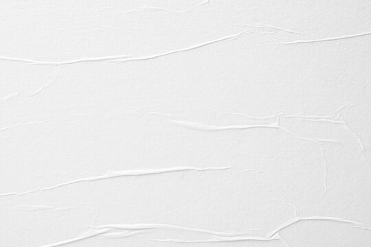 Paper texture with folds, close-up, abstract background.