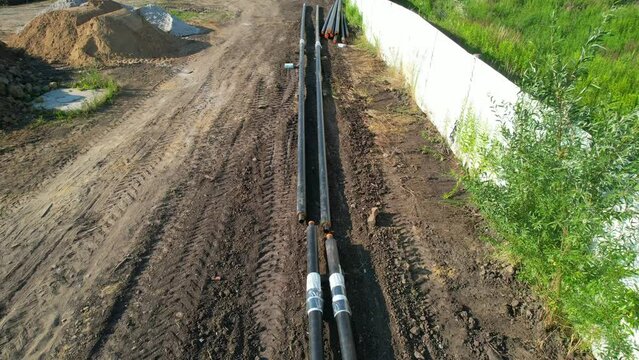  pipe replacement on a construction site. construction of new houses, preparation and installation of the heating system. Sewer pipes for laying an external sewage system