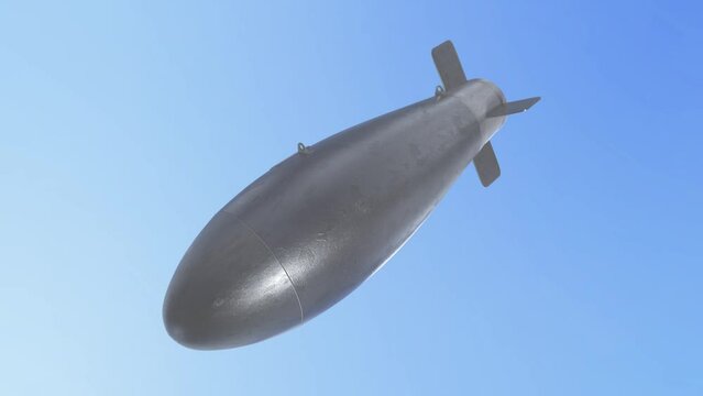 Falling bomb with flag of UKRAINE dropping through the clouds. Weapons of mass destruction. Nuclear, chemical weapons, radiation