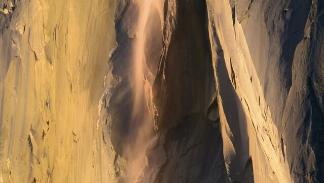 Exciting view of Horsetail fall in Yosemite National Park at sunset, California, USA. Closeup shot of wonderful Yosemite Firefall on top of El Capitan rock formation. Natural phenomenon, 4k footage