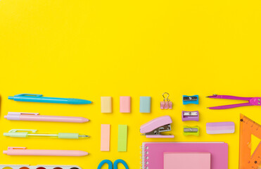 Flat lay with colorful school stationery on color backgroung, top view