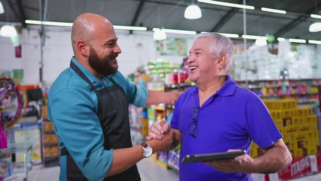 Grocery Store Boss Congratulating Employee For Good Job. High-Five Celebration For Supermarket Staff Achievement, Senior Manager Posing For Camera With Male Staff