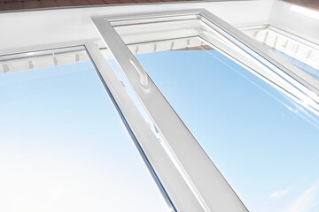 Opened plastic window frame for ventilation. PVC window. Tilted pvc window frame. Bottom view. Room ventilation.