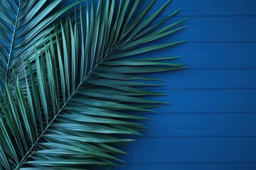 Background, palm leaves on a blue wooden background. AI generative.