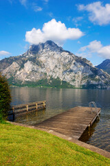 Fototapeta na wymiar Panoramic view of Traunstein at Traunsee lake during sunset, landscape photo of lake and mountains near Gmunden, Austria, Europe