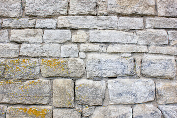 Fototapeta premium Old stonework. Ancient masonry blocks. Ancient stone wall.Old masonry from stone blocks. Ancient cobblestones stacked in a wall.