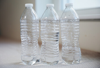 Plastic water bottles: convenience meets environmental concerns. Symbolizing convenience, but cautioning against environmental impact