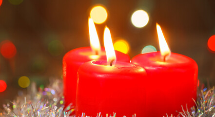 three burning candles. christmas background