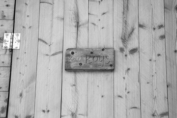 Black and white sign writing Beach Boys indicating a changing room or bathroom for boys visiting the beach