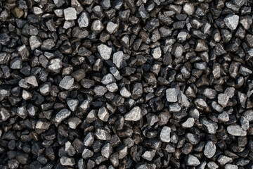 Small black pebbles close-up, background image