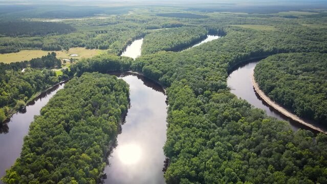 Flying over a very winding river and forest in Northern Minnesota near the border of Canada