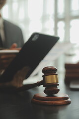 Business and lawyers discussing contract papers with brass scale on desk in office. Law, legal...
