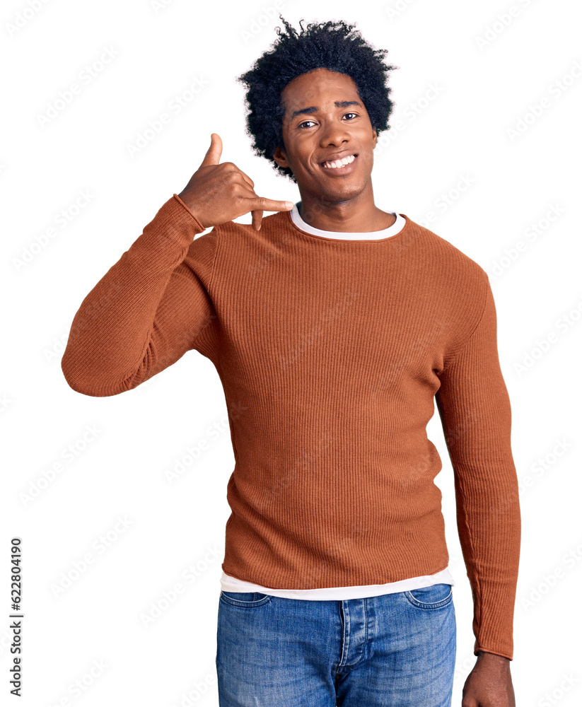 Sticker handsome african american man with afro hair wearing casual clothes smiling doing phone gesture with