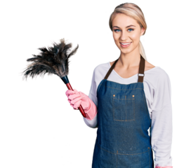Beautiful young blonde woman wearing apron holding cleaning duster with a happy and cool smile on face. lucky person.