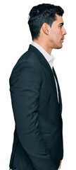Handsome hispanic man wearing business clothes looking to side, relax profile pose with natural face and confident smile.