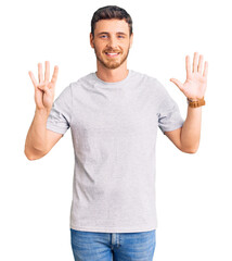 Fototapeta premium Handsome young man with bear wearing casual tshirt showing and pointing up with fingers number nine while smiling confident and happy.