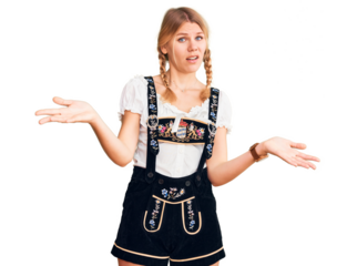 Young beautiful blonde woman wearing oktoberfest dress clueless and confused with open arms, no idea concept.