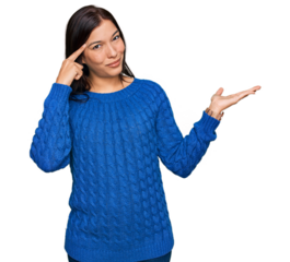 Young hispanic woman wearing casual clothes confused and annoyed with open palm showing copy space and pointing finger to forehead. think about it.