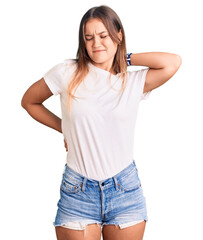 Fototapeta premium Beautiful caucasian woman wearing casual white tshirt suffering of neck ache injury, touching neck with hand, muscular pain