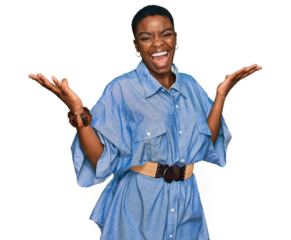 Young african american woman wearing casual clothes celebrating victory with happy smile and winner expression with raised hands