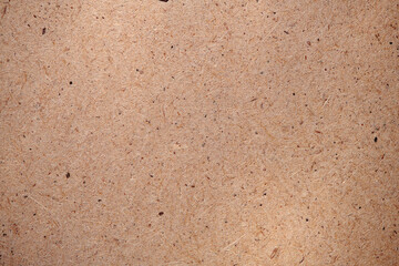 Hardboard surface for background or texture. Masonite Texture. Plywood hardboard background. Wooden board made of pressed sawdust. Top view.