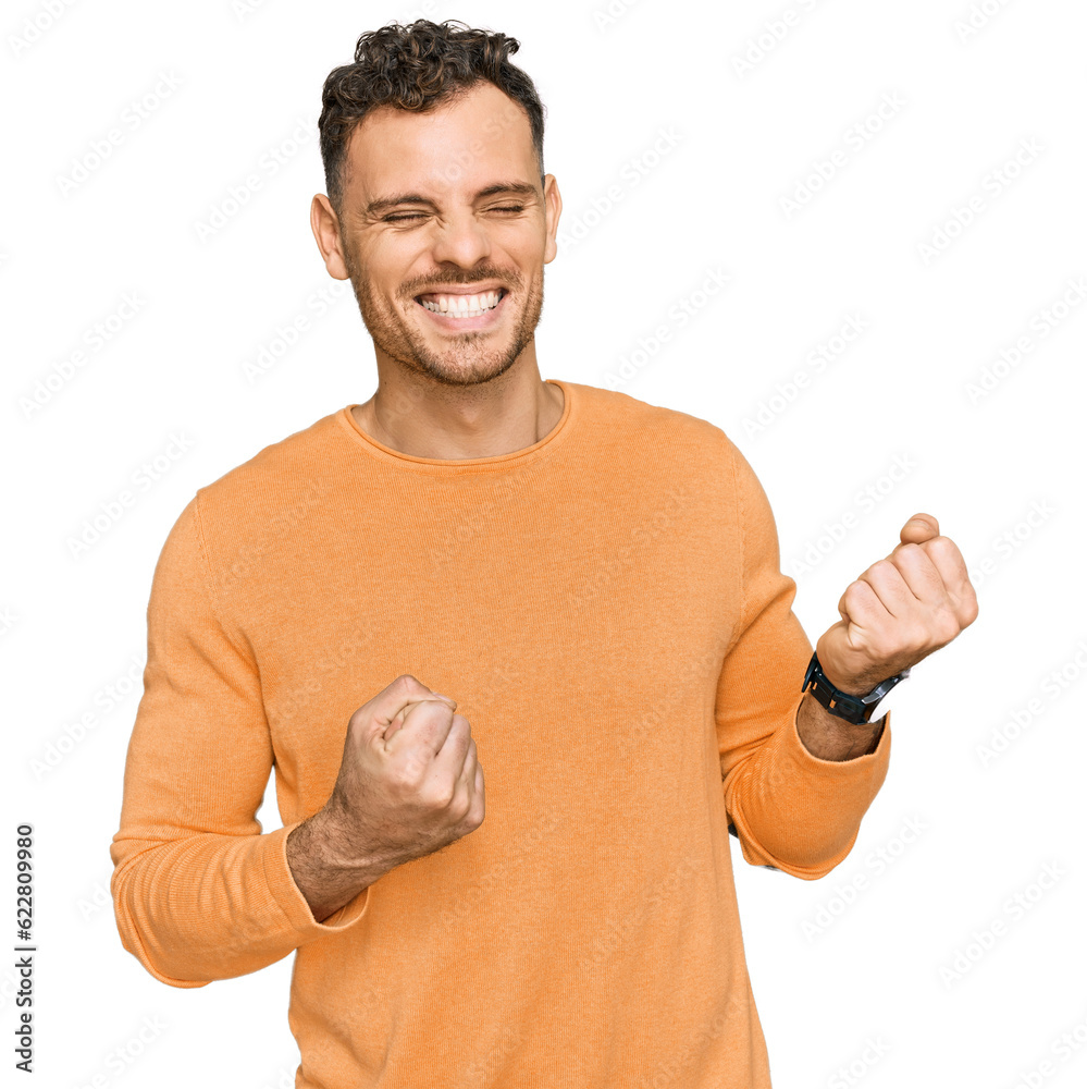 Sticker young hispanic man wearing casual clothes excited for success with arms raised and eyes closed celeb