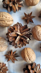 Christmas background with cones, nuts and anise