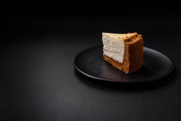 Delicious sweet cheesecake cake on textured concrete background
