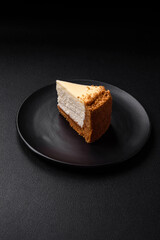 Delicious sweet cheesecake cake on textured concrete background