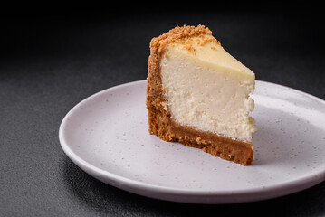 Delicious sweet cheesecake cake on textured concrete background