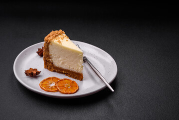 Delicious sweet cheesecake cake on textured concrete background