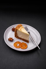 Delicious sweet cheesecake cake on textured concrete background
