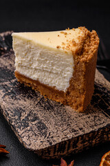 Delicious sweet cheesecake cake on textured concrete background