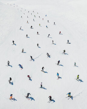 Aerial view of skiers composing a pattern, Sicily, Italy.