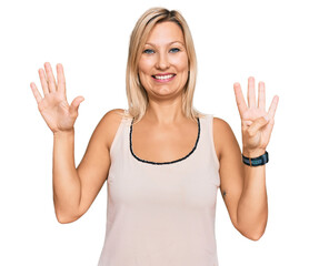 Middle age caucasian woman wearing casual clothes showing and pointing up with fingers number nine...