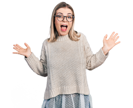 Young blonde woman wearing glasses celebrating crazy and amazed for success with arms raised and open eyes screaming excited. winner concept