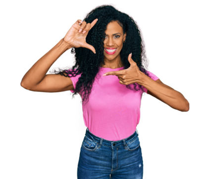 Middle age african american woman wearing casual clothes smiling making frame with hands and fingers with happy face. creativity and photography concept.