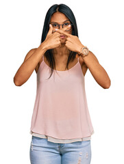 Young african american woman wearing casual clothes and glasses rejection expression crossing fingers doing negative sign