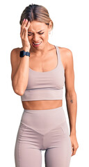 Beautiful caucasian woman wearing sportswear yawning tired covering half face, eye and mouth with hand. face hurts in pain.