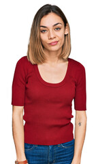 Fototapeta premium Young blonde girl wearing casual clothes looking sleepy and tired, exhausted for fatigue and hangover, lazy eyes in the morning.