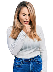 Young blonde woman wearing casual clothes feeling unwell and coughing as symptom for cold or bronchitis. health care concept.