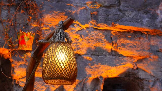 vintage lantern lamp against a wall 