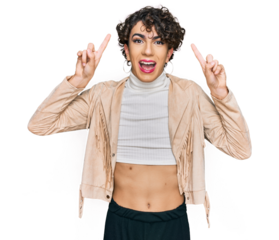 Handsome man wearing make up and woman clothes smiling amazed and surprised and pointing up with fingers and raised arms.