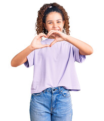 Fototapeta na wymiar Beautiful kid girl with curly hair wearing casual clothes smiling in love doing heart symbol shape with hands. romantic concept.