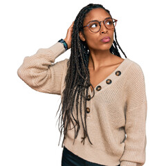 African american woman wearing casual clothes confuse and wondering about question. uncertain with...