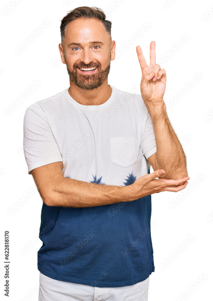 Sticker handsome middle age man wearing casual tie dye tshirt smiling with happy face winking at the camera 