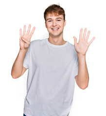 Young caucasian man wearing casual white t shirt showing and pointing up with fingers number nine while smiling confident and happy.