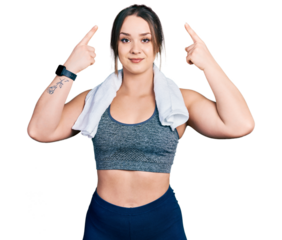 Young hispanic girl wearing sportswear and towel smiling pointing to head with both hands finger, great idea or thought, good memory