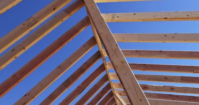 Framed structure construction of interior beams wood board assembled on roof supports trusses